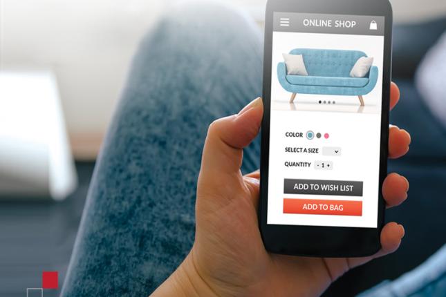 Person selecting sofa online on cell phone